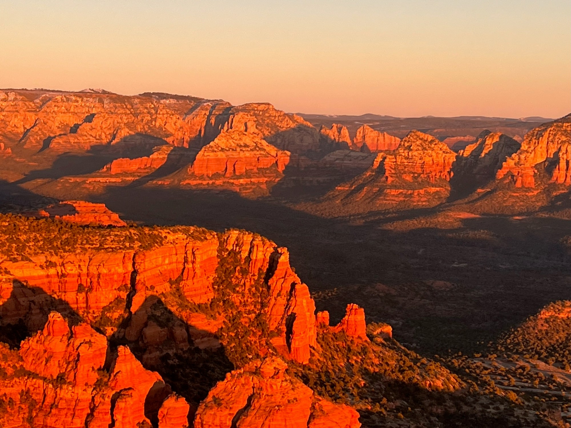 IMG_2124 a canyon with a sunset in the background