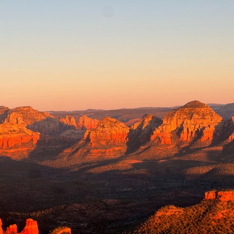 a canyon with a sunset in the background