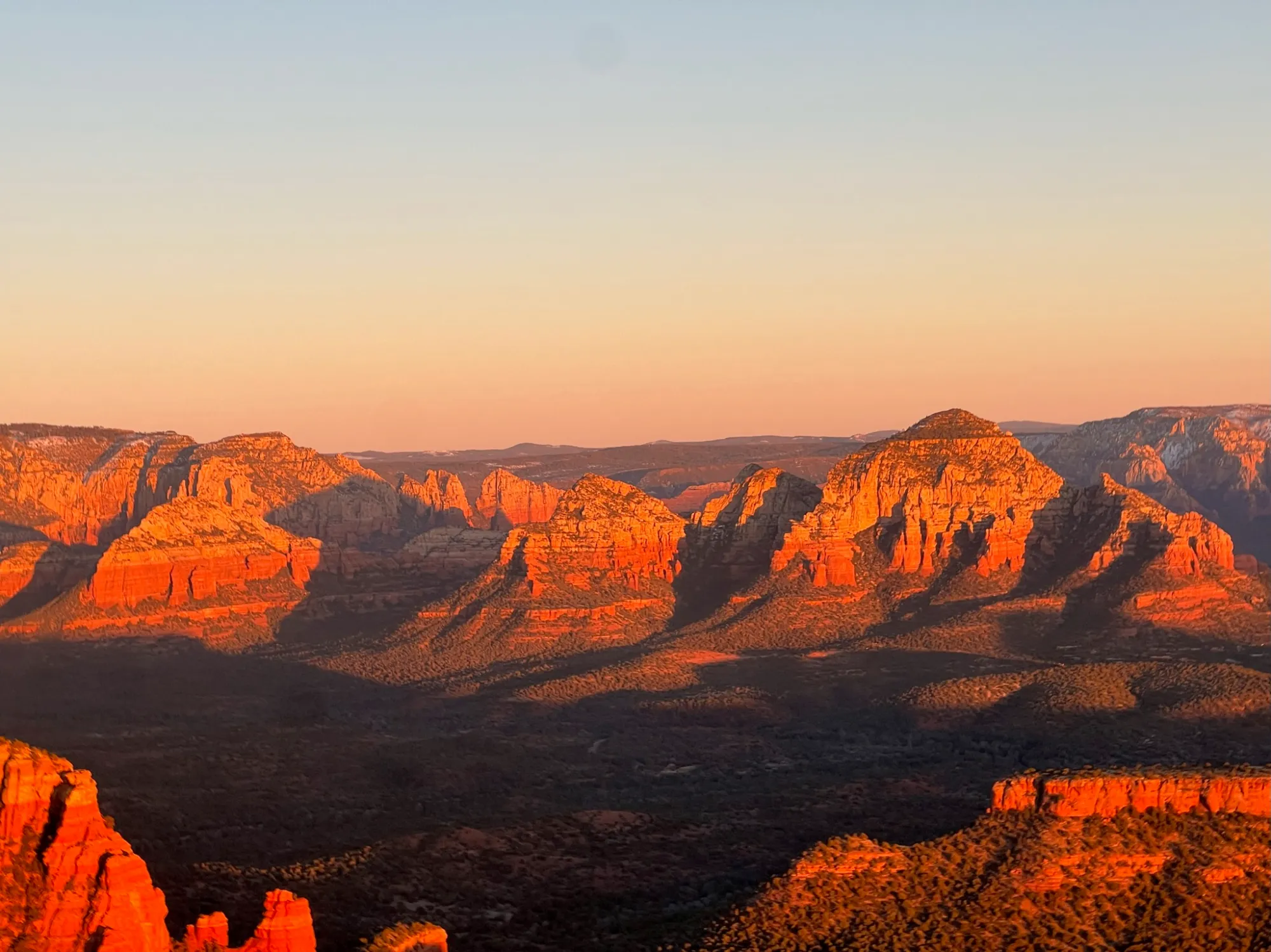 IMG_2125 a canyon with a sunset in the background