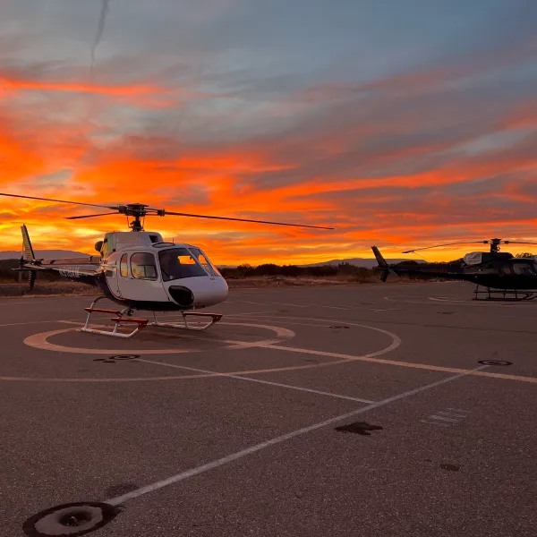 APEX AIR TOURS HELICOPTER AT THE SEDONA AIRPORT DURING SUNSET TIME