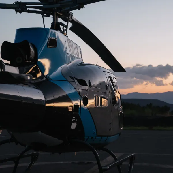 a helicopter parked on the side of a road