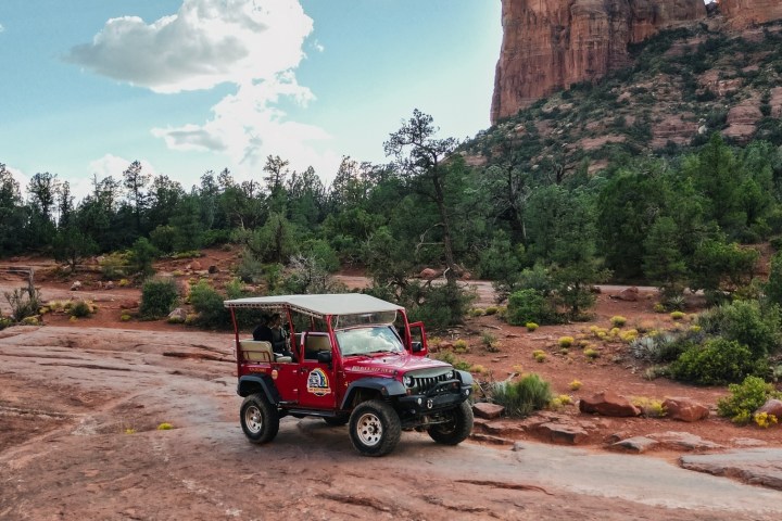 a truck driving down a dirt road